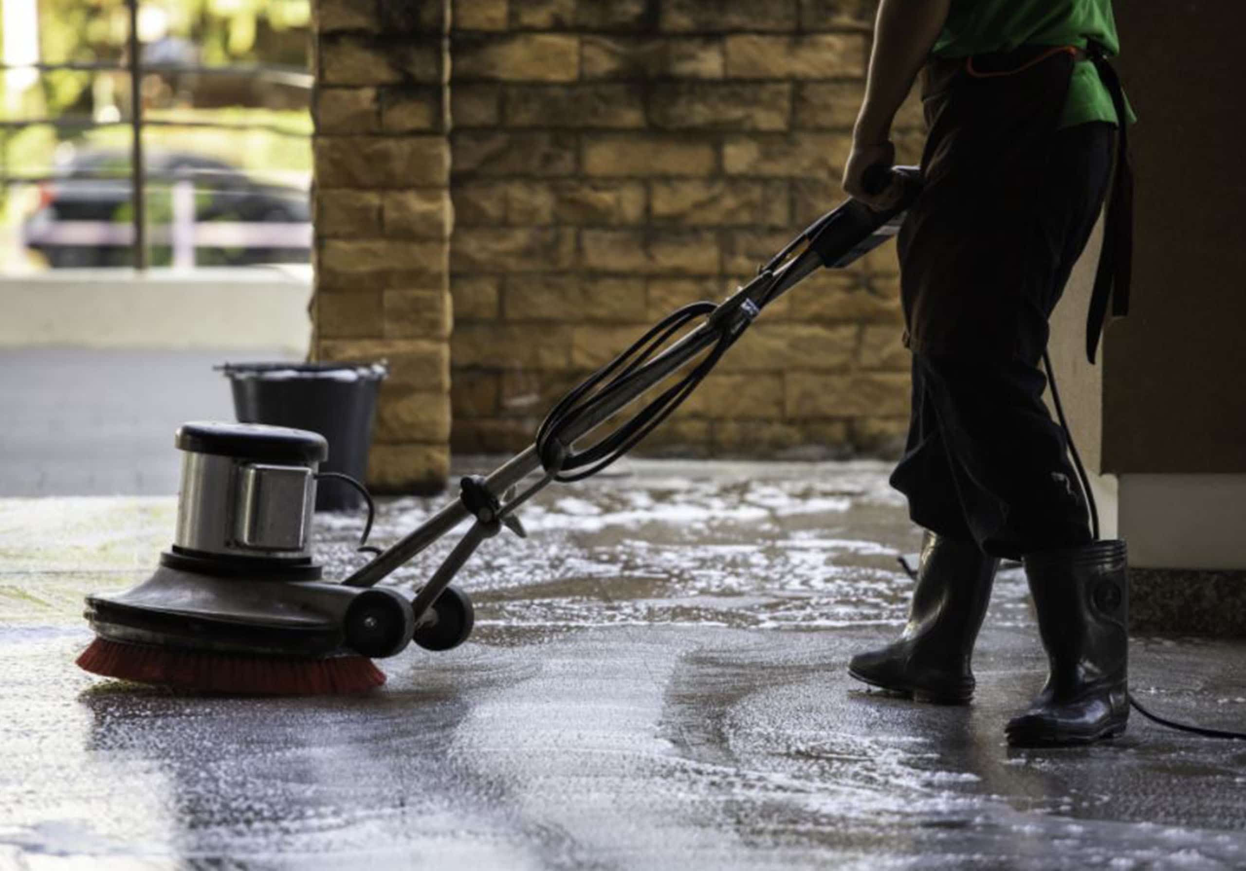 A person doing vacuum cleaning